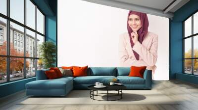 Beautiful business woman with hijab portrait on white background Wall mural