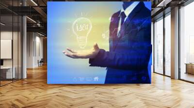 business man with idea lamp on his hand,idea concept Wall mural