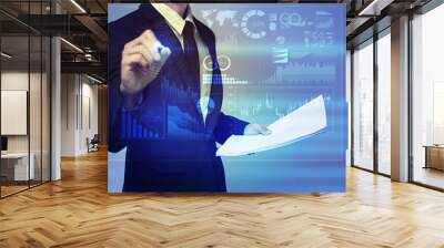 Businessman in blue suit working with digital virtual screen Wall mural