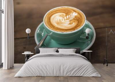 hot cappuccino with latte art on wood background Wall mural