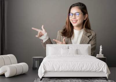 Portrait of Attractive business woman in studio grey background Wall mural