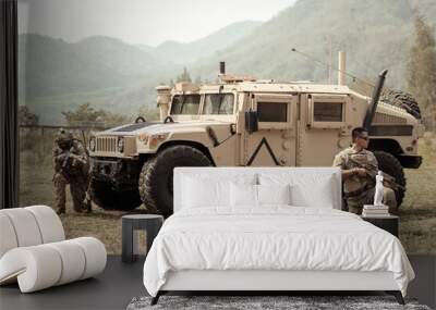 United States Army in camouflage uniforms operation in the forest.with armored vehicle, soldiers training  in a military operation Wall mural