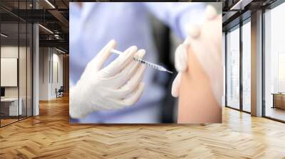 Close up of doctor making a vaccination in the shoulder of patient, Flu Vaccination Injection on Arm. covid-19 vaccine disease preparing for human clinical trials vaccination shot. Wall mural