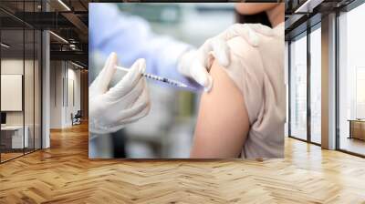 Close up of doctor making a vaccination in the shoulder of patient. coronavirus, Flu Vaccination Injection on Arm, covid-19 vaccine disease preparing for human clinical trials vaccination shot. Wall mural