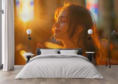 A young woman in a church, praising God. Religious belief and belief in God Wall mural