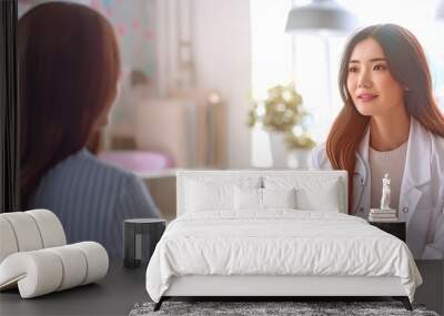 Asian woman patient visits and discusses health issues with a young physician Wall mural