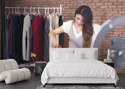 beautiful Asian woman standing among several boxes and checking parcels, working in the house office. Concept for home base business and startup ownership Wall mural