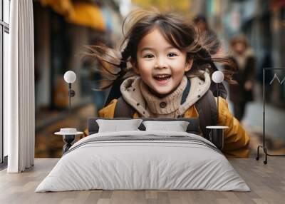 Cute Asian girl running and having fun as she heads to school Wall mural