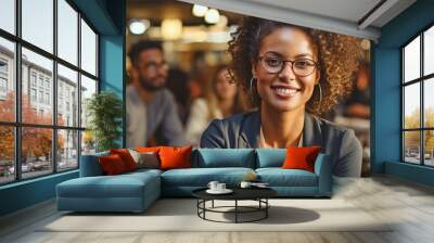 Portrait of a middle-aged, multiracial LGBTQ entrepreneur in the boardroom, listening to female coworkers. Wall mural