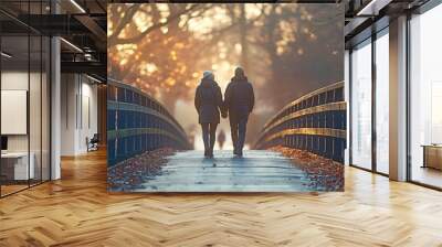 Two people are strolling on a bridge in the dusk. Wall mural