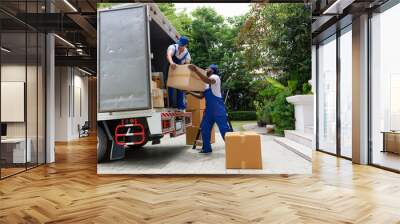 Professional goods move service use truck carry personal belongings door to door transport delivery handover boxes luggage one by one and keep stack on the floor before transfer to place in house
 Wall mural