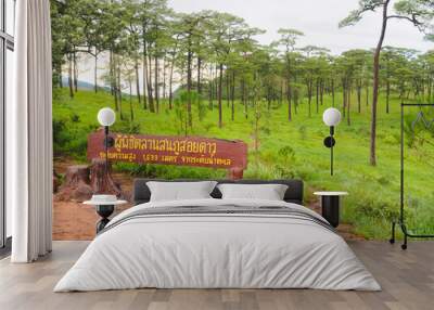 Beautiful scenery of Phu Soi Dao National Park after the rain, amidst the lush green scenery. The sign reads 