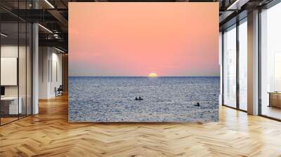 Beautiful sunset with orange sky on the beach of Menorca, Balearic Islands. Sunset, nature Wall mural