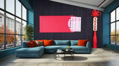 chinese lucky coins and red envelope on black bamboo mat Wall mural