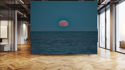 Full moon rises over the Atlantic ocean Wall mural