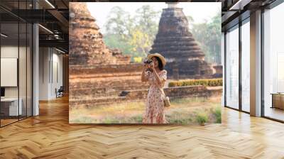 Beautiful women visiting attractions and landmarks in Thailand  women happy tourists exploring a south-east asian city Wall mural