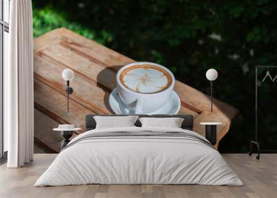 hot latte art coffee cup on wooden table Wall mural