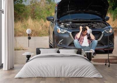 Man fixing a car problem after vehicle breakdown on the road Wall mural