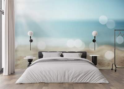 Blur tropical beach with bokeh sun light wave abstract background. Wall mural