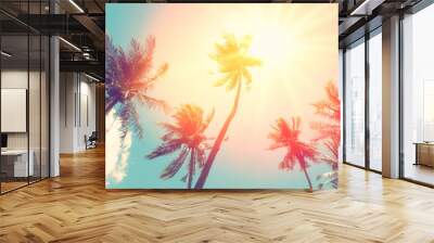 Copy space of tropical palm tree with sun light on sky background. Wall mural