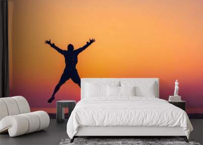 Man jumping on tropical beach with sunset sky and island background. Freedom and feel good concept. Wall mural