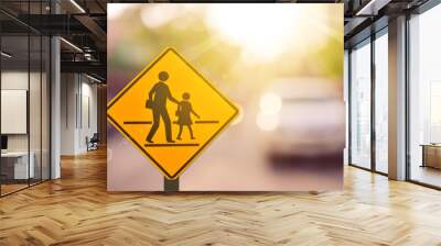 School zone warning sign on blur traffic road with colorful bokeh light abstract background. Wall mural