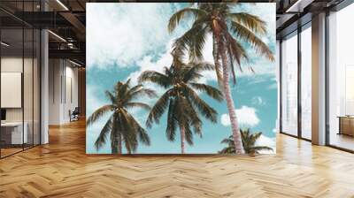 Tropical palm tree with blue sky and cloud abstract background. Summer vacation and nature travel adventure concept. Wall mural