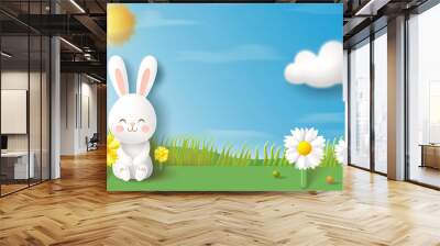 a cartoon bunny sitting on a grass field Wall mural