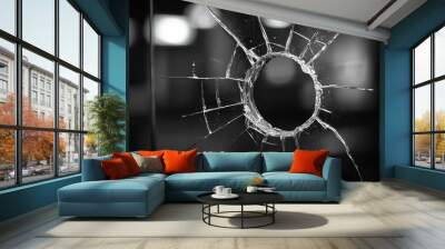 Close-up view of a shattered glass window with a bullet hole, showcasing the intricate patterns of cracks radiating from the center. Wall mural