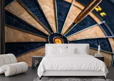 Close-up of a dartboard with a dart hitting the bullseye, symbolizing precision, accuracy, and goal achievement. Wall mural