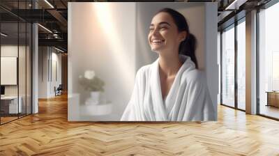 a beautiful woman smiling in the bathroom wearing white robe Wall mural