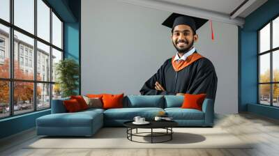 a male indian graduation student wearing graduation gown Wall mural