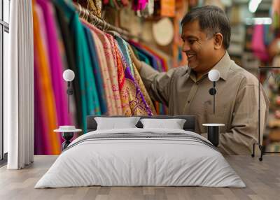 indian man shopping in the indian clothes shop bokeh style background Wall mural