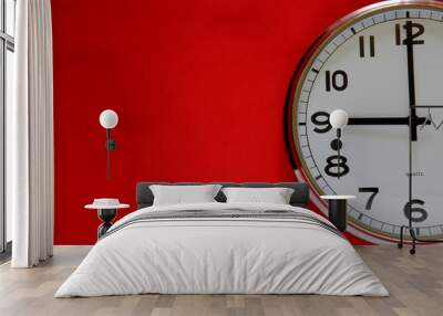 Clock on the red background with space for text Wall mural