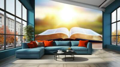 A book is open to a page with a sun shining on it Wall mural