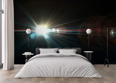 A bright light is shining on a dark background, lens flare effects for overlay designs Wall mural