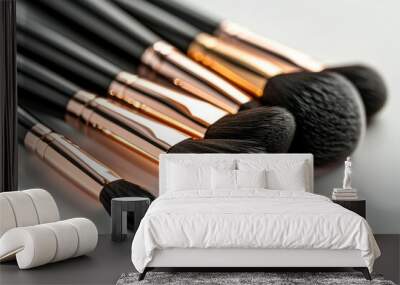 A close up of five makeup brushes, all black and gold Wall mural