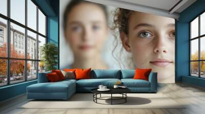 A girl with brown hair and a light brown face is smiling Wall mural