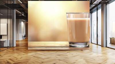 A glass of milk is sitting on a wooden table Wall mural