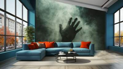 A hand is shown in the air with smoke surrounding it Wall mural