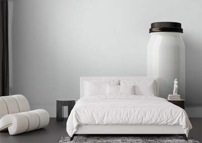 A jar is sitting on a white background Wall mural