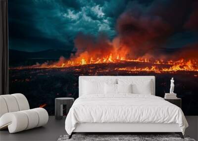 A large field of fire with smoke in the sky Wall mural