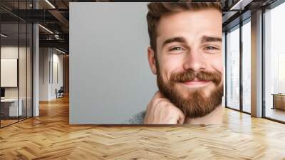 A man with a beard and a smile on his face Wall mural