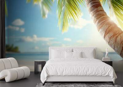 A palm tree is in the foreground of a beautiful beach scene Wall mural