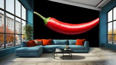 A red pepper is shown on a black background Wall mural