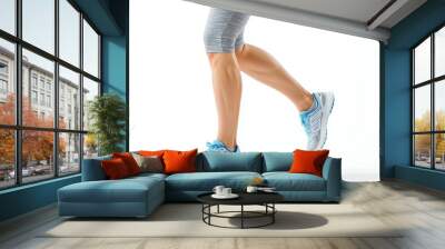 A woman is wearing a blue and white running shoe and shorts Wall mural