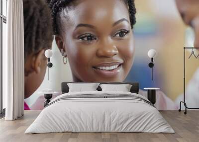 A woman with a smile on her face is looking at two children Wall mural