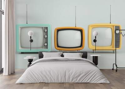 Three televisions of different colors are lined up on a white surface Wall mural