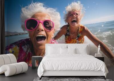 Two happy pensioners have fun in the sea. Portrait with selective focus Wall mural