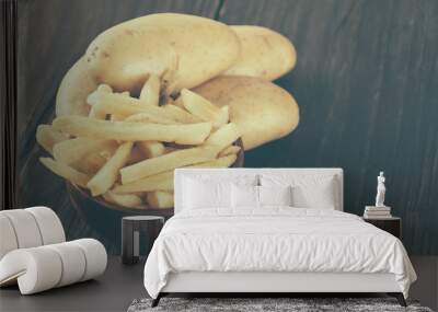 french fries on wood background - soft focus with vintage film f Wall mural